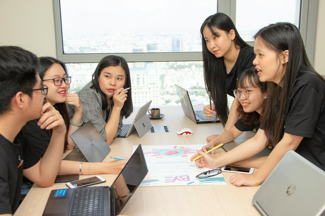 group of students coding together
